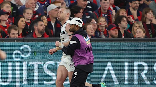 Sam Docherty of the Blues comes off the ground.