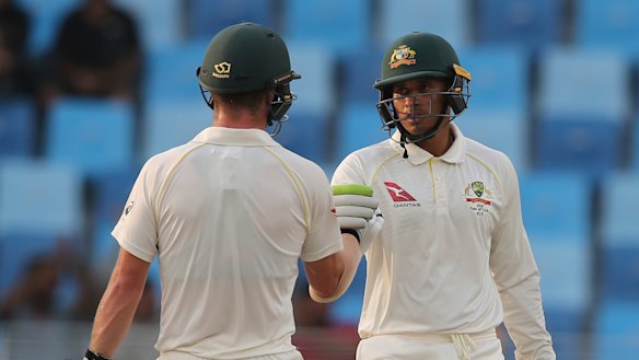 Head (left) and Khawaja will resume in the middle on day five.