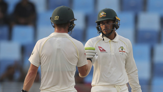 Head (left) and Khawaja will resume in the middle on day five.