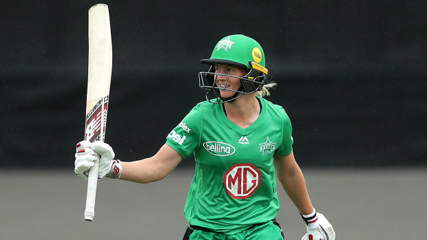 Meg Lanning of the Stars celebrates after scoring a half century during the Women's Big Bash League match between the Melbourne Renegades and the Melbourne Stars at Hurstville Oval in Sydney on Sunday.