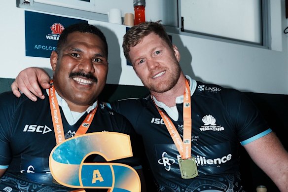 Apolosi Ranawai poses with Matt Philip after winning Super Rugby Australia in 2025.