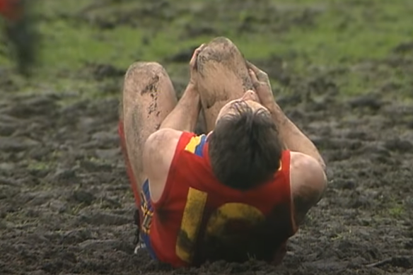 Tony Hall clutches his knee after being injured in a tackle during the 1989 State of Origin clash at the MCG.