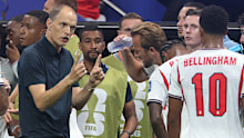  Tuchel speaks to the team during a hydration break.