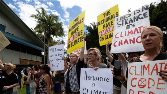 Protestors at Lismore Council Chambers wait for the Prime Minister Scott Morrison on March 9.