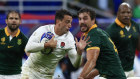 England’s Alex Mitchell challenges for the ball with South Africa’s Eben Etzebeth. 