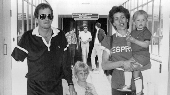 Jack Newton leaving hospital with his wife and children.