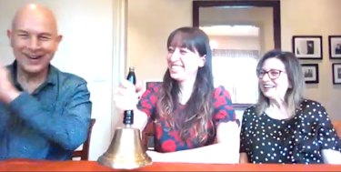 Trajan Group co-founders Stephen and Angela Tomisich, and their daughter Danielle, ringing the bell, at a virtual ASX listing on Monday.  They were unable to attend in person due to COVID-19 restrictions in Melbourne.