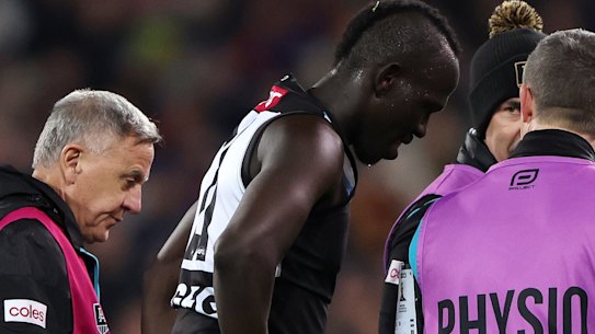 Port Adelaide’s Allir Aliir leaves the ground after the collision with teammate Lachie Jones on saturday night.