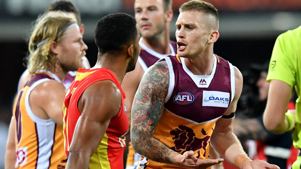 Dayne Beams offers Touk Miller some words of advice.