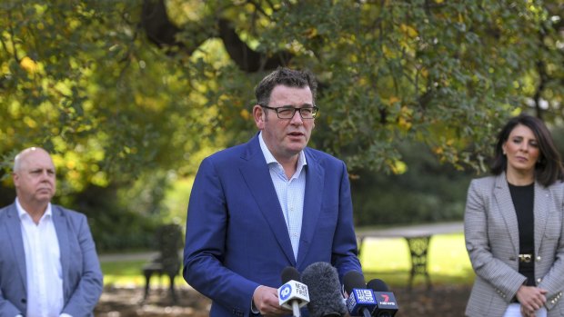 Premier Daniel Andrews flanked by Treasurer Tim Pallas and Consumer Affairs Minister Marlene Kairouz yesterday. 