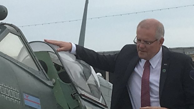 PM Scott Morrison inspects a World War II Spitfire aircraft at D-Day commemorations in Portsmouth, UK.