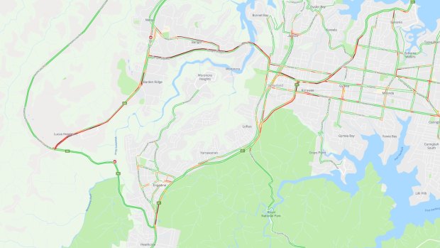 Traffic is heavy after a four-car crash on New Illawarra Road at Lucas Heights. Map shows traffic as at 5pm.