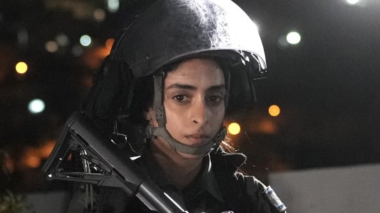 Police are present before the release of Palestinian prisoner Israa Jaabis as part of a deal between Israel and Hamas on November 26 in the Jabel Mukaber neighbourhood of East Jerusalem. 