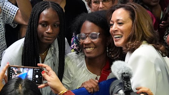 Democratic presidential nominee Vice President Kamala Harris poses for photos with supporters at a campaign rally in Savannah, Georgia.