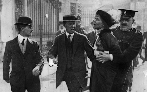 Suffragette leader Emmeline Pankhurst  is arrested outside Buckingham Palace in 1914.
