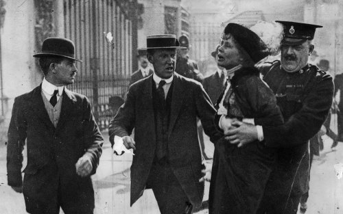 Suffragette leader Emmeline Pankhurst  is arrested outside Buckingham Palace in 1914.
