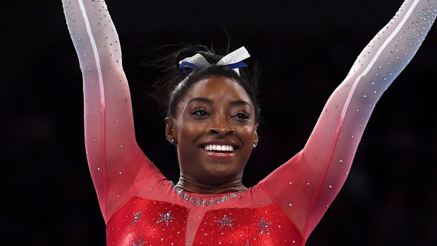 Peerless: Simone Biles waves to the crowd after finishing her floor routine during the women's team finals at the FIG Artistic Gymnastics World Championships in Stuttgart.