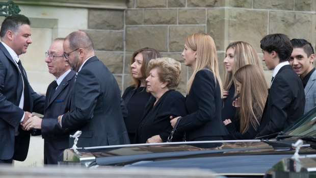 Mourners arrive for the 2016 funeral of gangland lawyer Joseph 'Pino' Acquaro at St Mary's Star of Sea Catholic Church in West Melbourne.