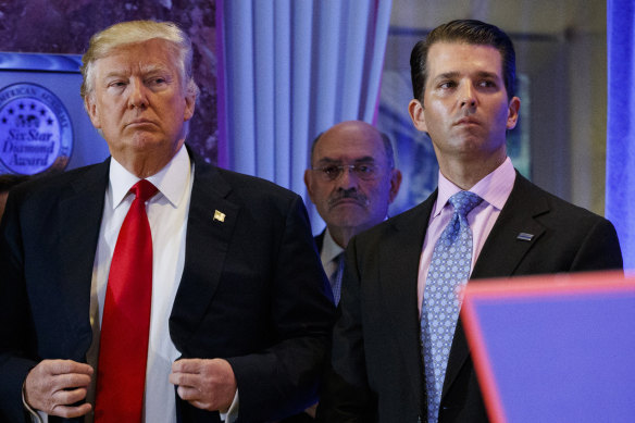 Donald Trump with chief financial officer Allen Weisselberg, centre, and son Donald jnr in 2017.