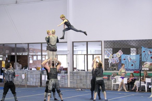 A young, airborne Cassiel Rousseau during his acrobatics days with Robertson Gymnastics Academy.