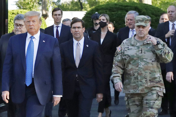 General Milley is pictured on the right, walking with  the president on June 1, 2020, to the photo opp at a church during the Black Lives Matter protests. 
