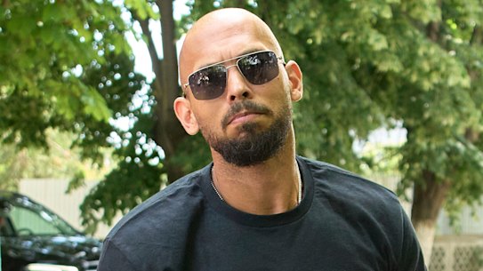Andrew Tate arrives at a police station in a Lada vehicle in Voluntari, Romania, Wednesday, May 21, 2025. (AP Photo/Vadim Ghirda)