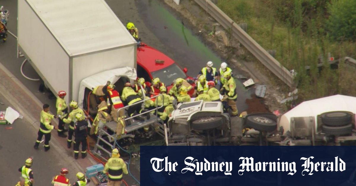 Wetherill Park crash leaves two men pinned in burning truck