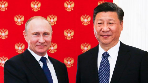Russian President Vladimir Putin, left, and China's President Xi Jinping were both in Soros's sights.