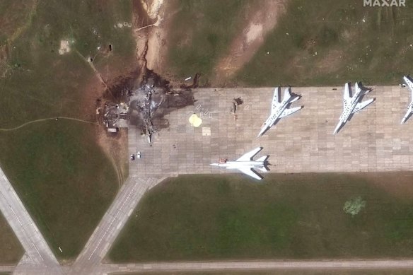 The apparent wreckage of a TU-22 bomber besides other intact TU-22 aircraft at Belaya air base.