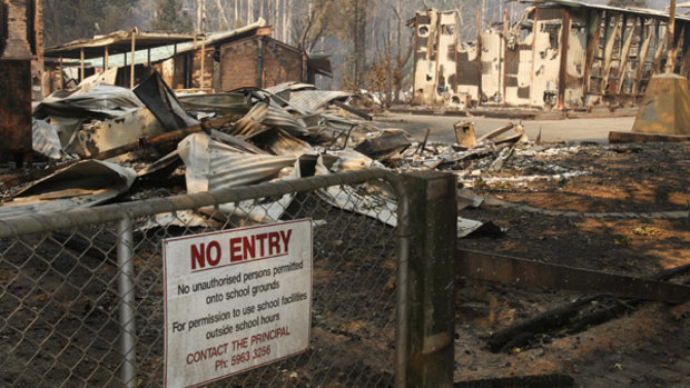 The Marysville primary school in ruins after the 2009 bushfires. Women have more to fear than Mother Nature when natural disasters strike.