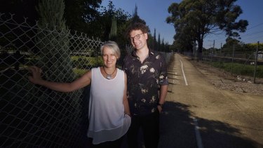 Artist Malcolm Angelucci and Majella Thomas at the bike path next to the Fawkner Cemetery.