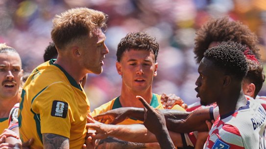Australia’s Harry Souttar (19), left, and United States’ Folarin Balogun (20), right, argue during their World Cup clash in Seattle. 