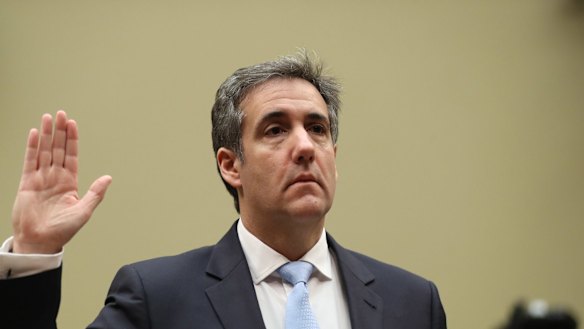 Michael Cohen takes the oath ahead of his congressional testimony.