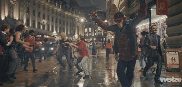 The previous shot now features a performing monkey that Robbie Williams thinks he has often been during his career.