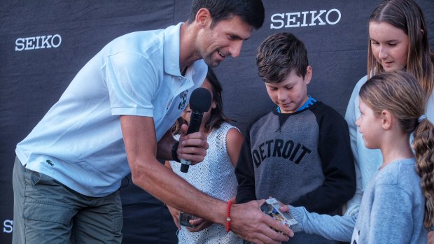 Out and about: World No.1 Novak Djokovic meets young fans at Federation Square in Melbourne on Wednesday.