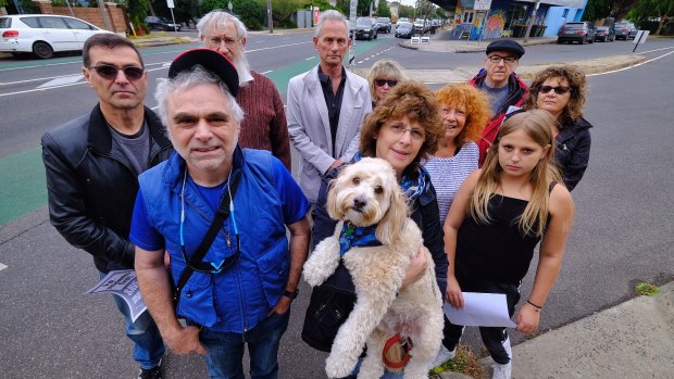 Save Inkerman members including Robyn Taft  (right, with dog) and Moishe Wolf, front left, oppose a bicycle super trail going down Inkerman Road, Caulfield North.
