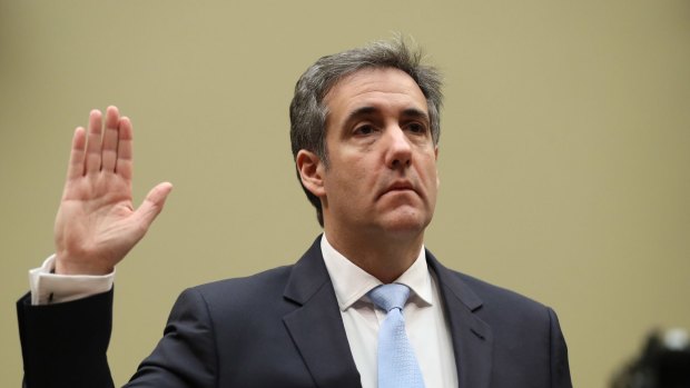 Michael Cohen takes the oath ahead of his congressional testimony.