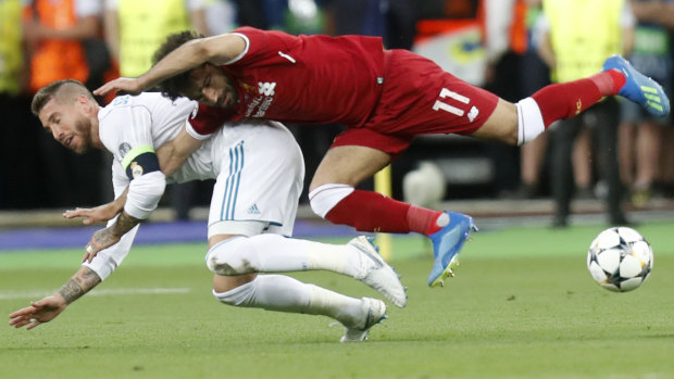 Grudge match ... Sergio Ramos pulls down Mohamed Salah in the 2018 Champions League final.