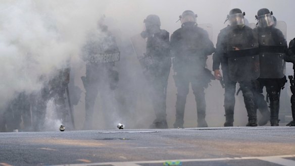 Police stand near tear gas during a demonstration in Atlanta over the death of George Floyd, who died on May 25 in Minneapolis.
