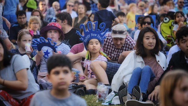 Families arrive for the fireworks in Melbourne. 