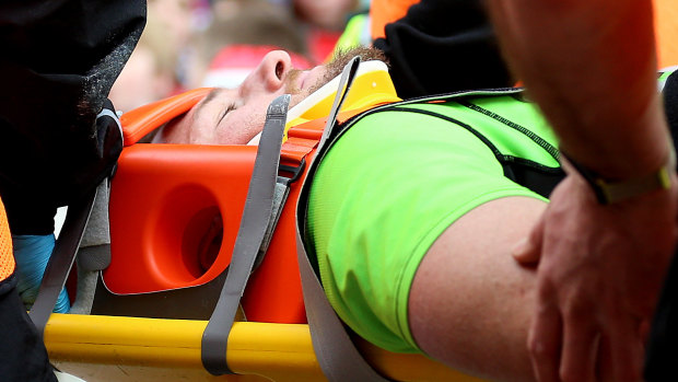 Career ending: Rob Horne is stretchered off during the Aviva Premiership match at Welford Road, Leicester.