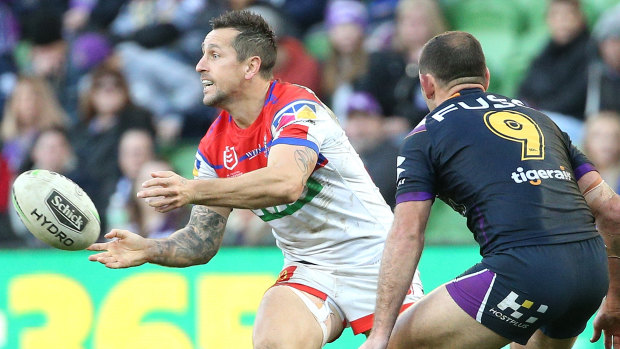 Brought back to Earth: Mitchell Pearce under pressure from his old Origin nemesis Cameron Smith.
