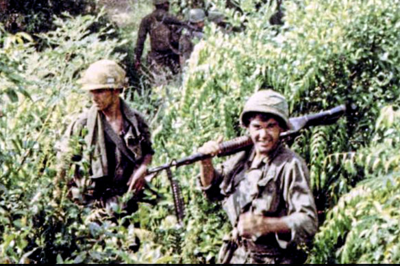 Oliver Stone, right, serving in 1967 or 1968 in South Vietnam. 