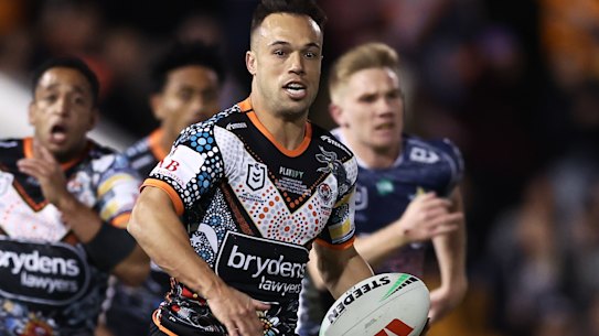Wests Tigers halfback Luke Brooks makes a break on Saturday night.