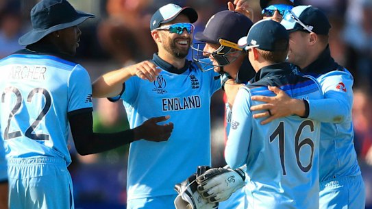 England celebrates after winning the Cricket World Cup match.