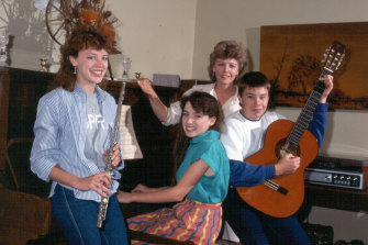 The good old days: Kylie Minogue with sister Dannii, brother Brendan and their mother Carol.