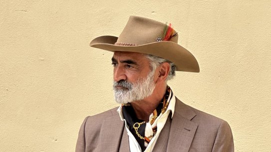 Australian model Marty Thomas in his own hat and a Farage suit at Pitti Uomo in Florence, Italy.