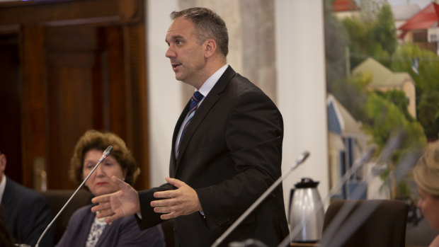 Jamboree ward councillor and city planning committee chair Matthew Bourke speaking in the council chambers.