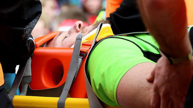 Horne is stretchered off during the Aviva Premiership match at Welford Road, Leicester, in April.