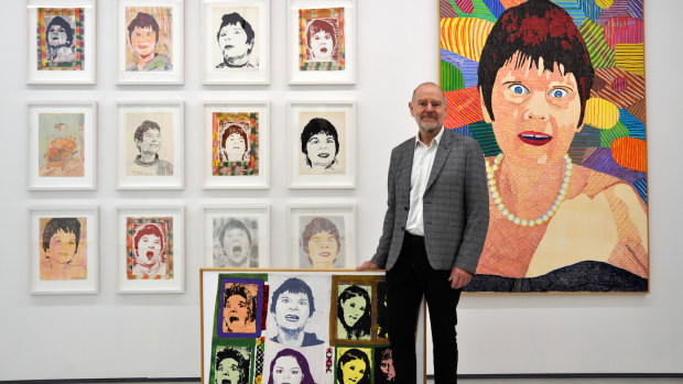 Curator Christopher Hodges with some of Richard Larter's depictions of his wife, Pat. 
